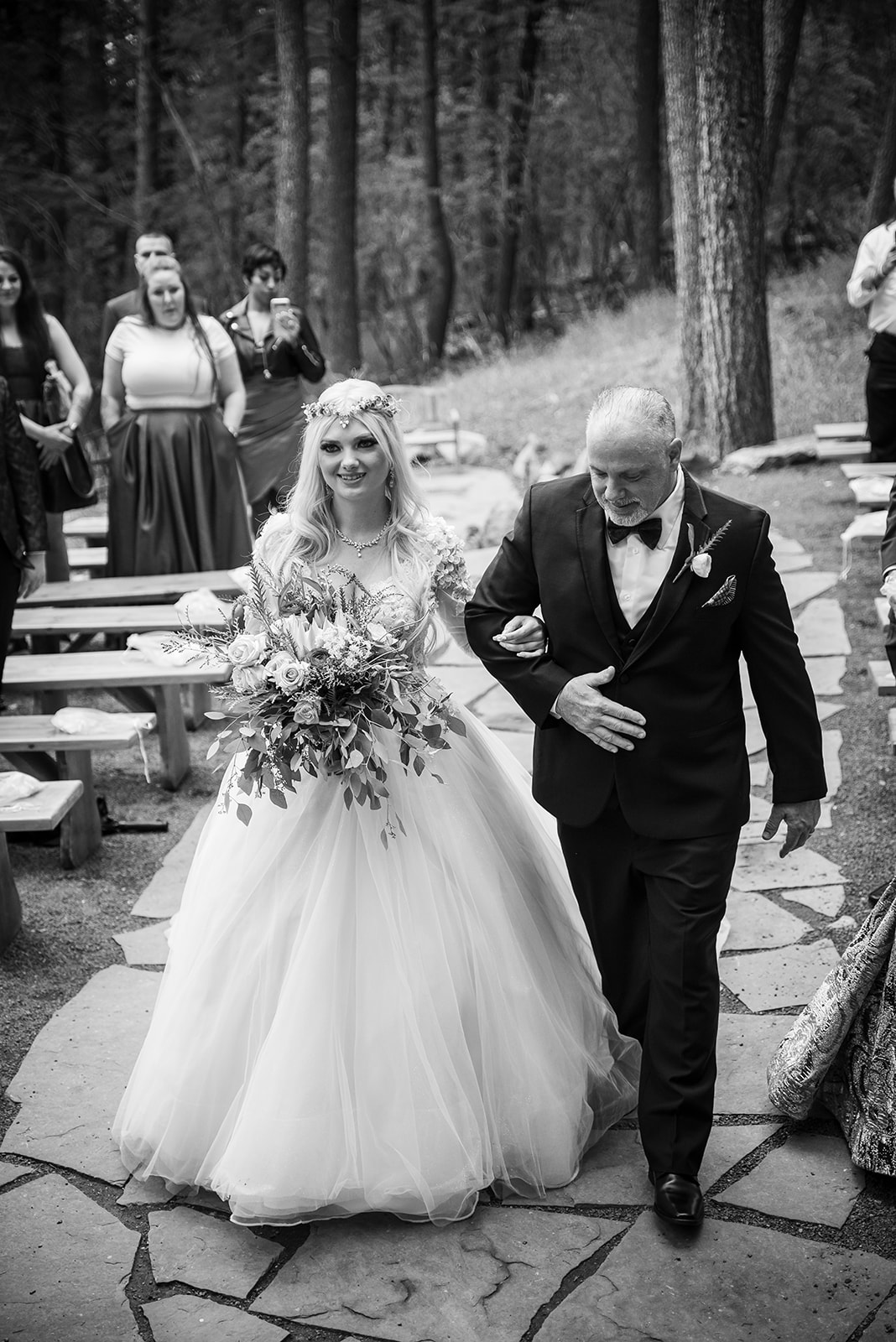 Bride's father walks her up the aisle.