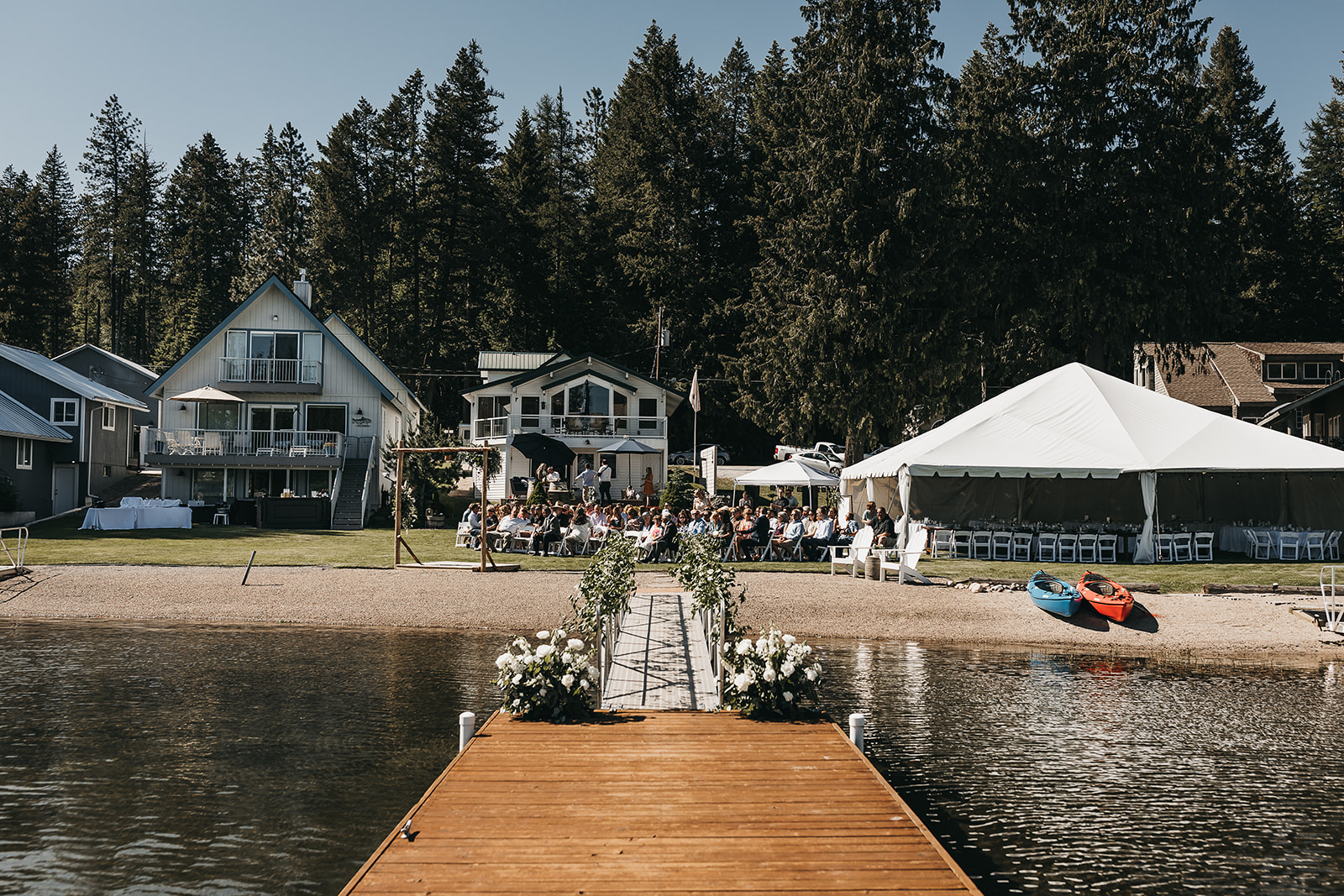 Lake front wedding ceremony at a private family lake house with private dock.