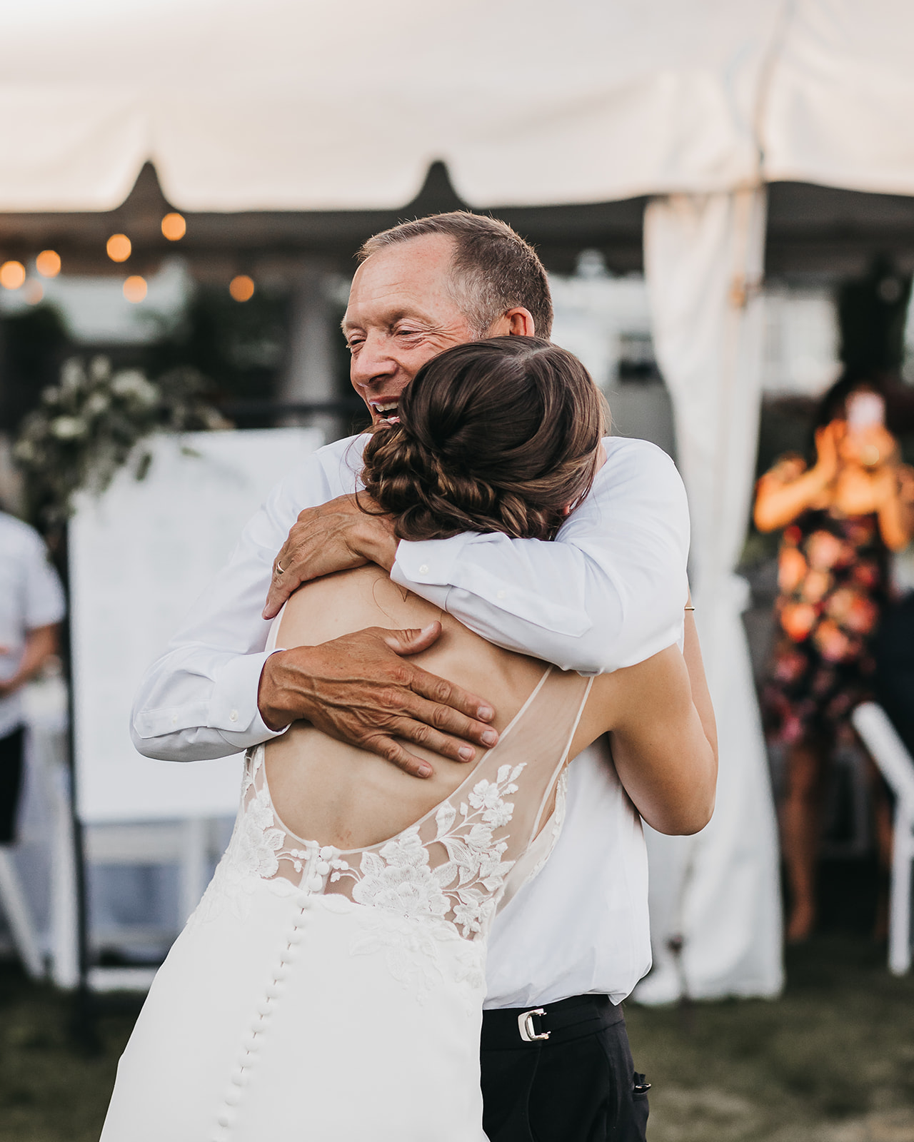 Father daughter dance at wedding reception at private lake house wedding. 