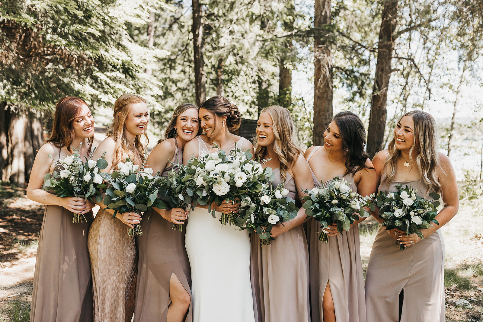 Bride and bridesmaids before the wedding ceremony at private lake house.