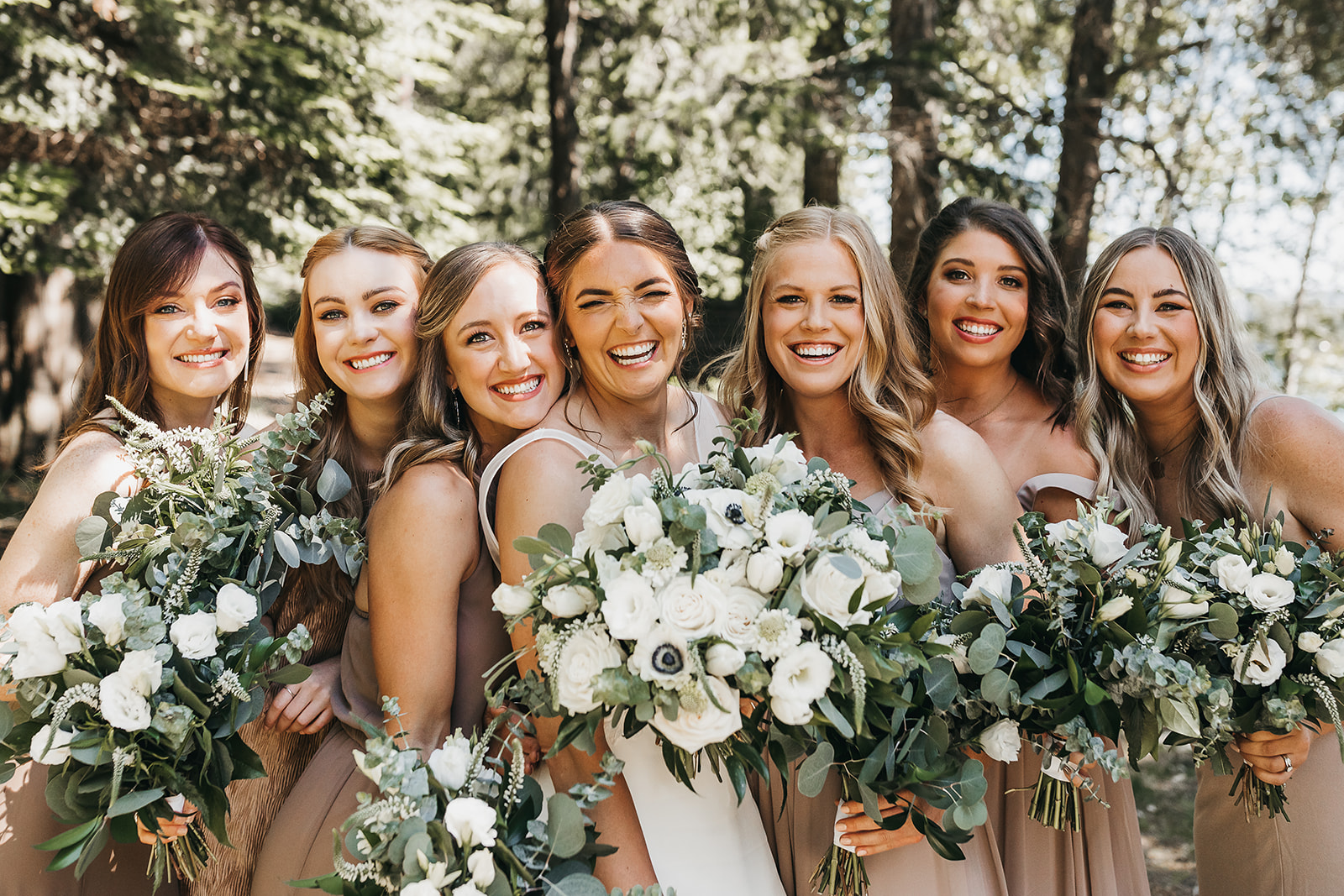 Bride and bridesmaids before the wedding ceremony at private lake house.