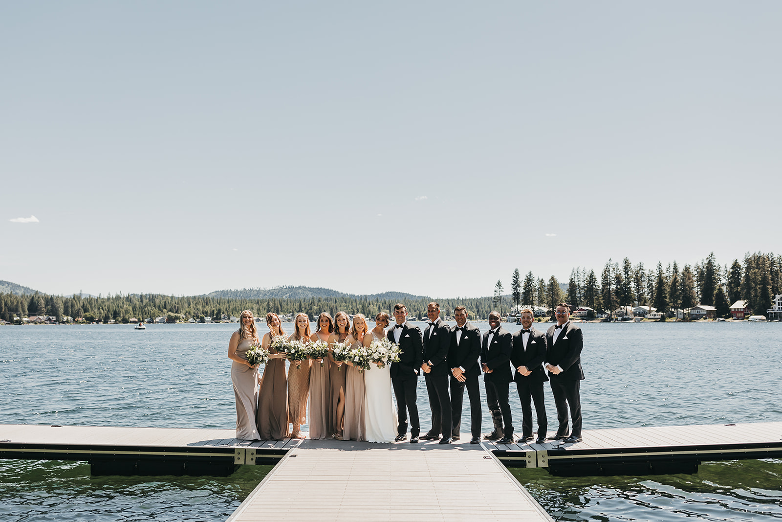 Wedding party on private dock before wedding ceremony on private lake front property.