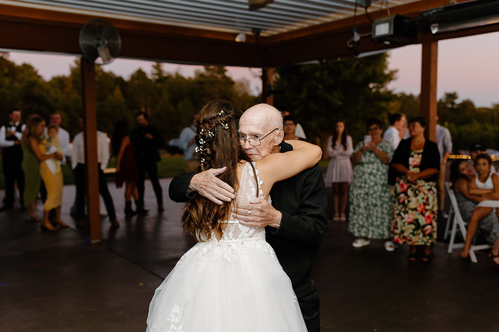 Bride and her grandfather share a hug