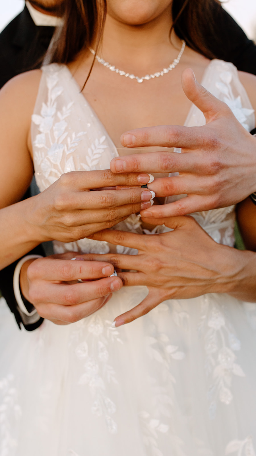 Bride and groom put rings on each other's fingers