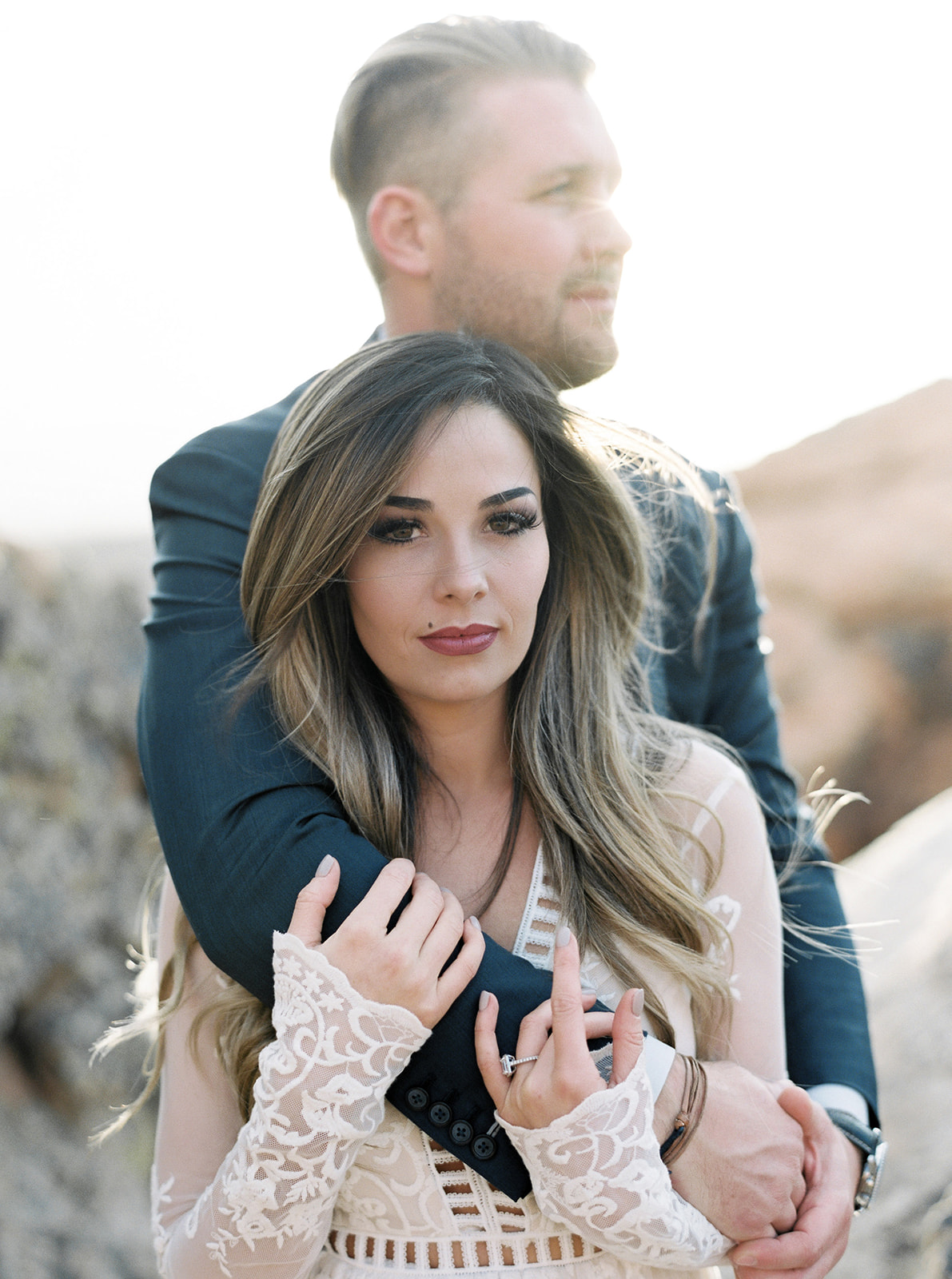 Portrait of the bride and groom with the bride holding the grooms arm. Taken during their Zion National Park Elopement. 