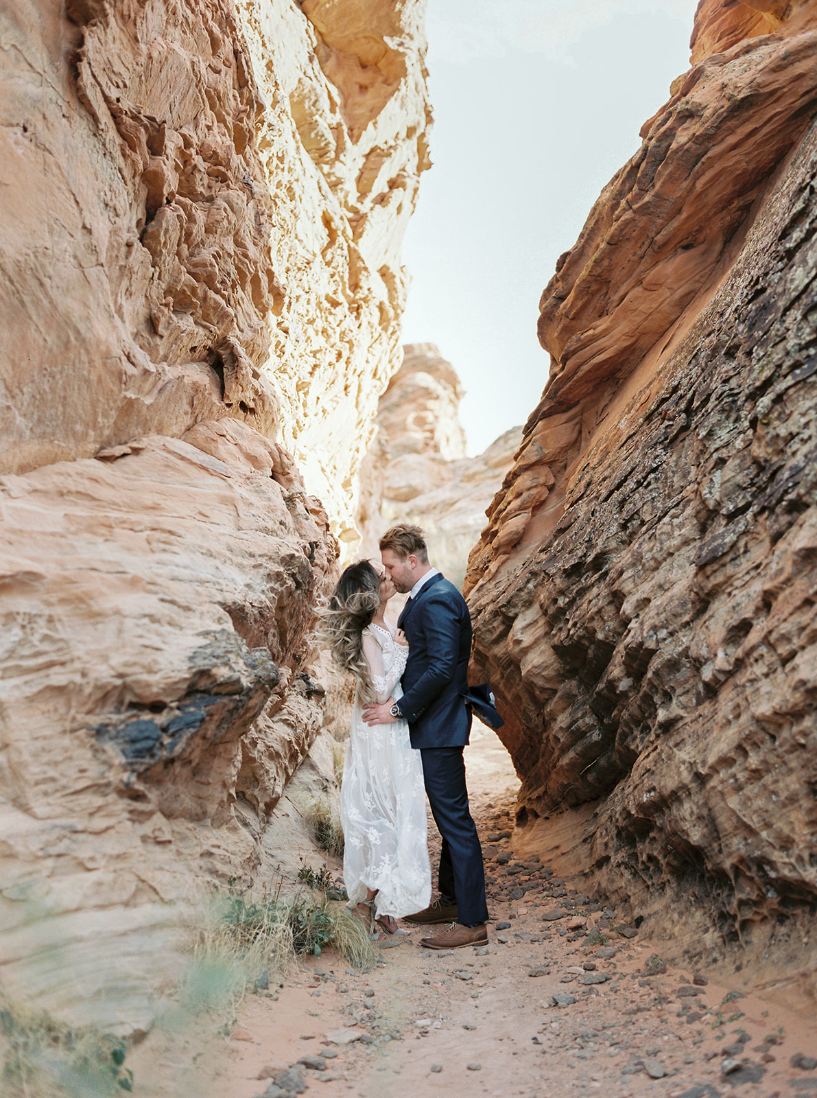 Bride and groom kissing in a slot canyon during their zion national park elopement