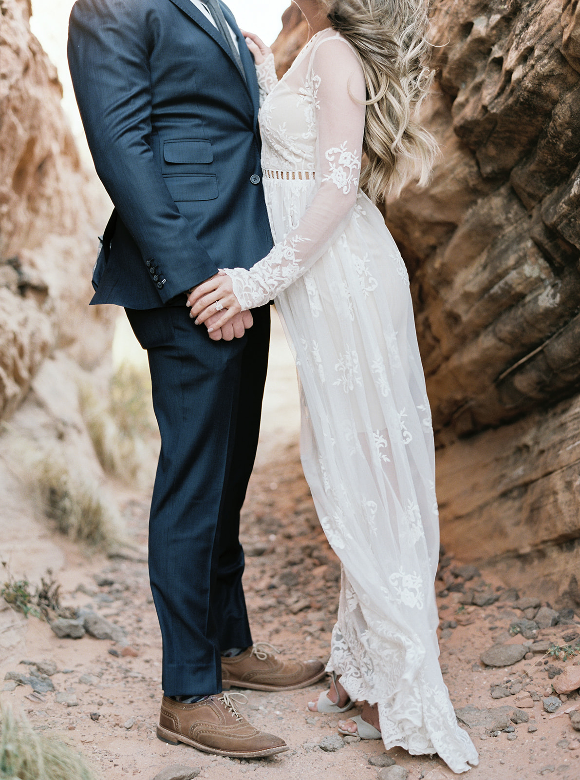 bride and groom kissing in a slot canyon in zion national park
