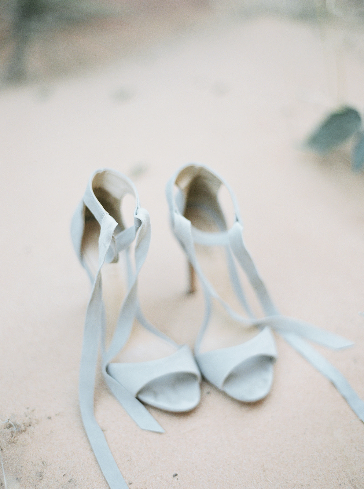 pictures of the brides shoes she took off to climb some rocks during her zion national park elopement 