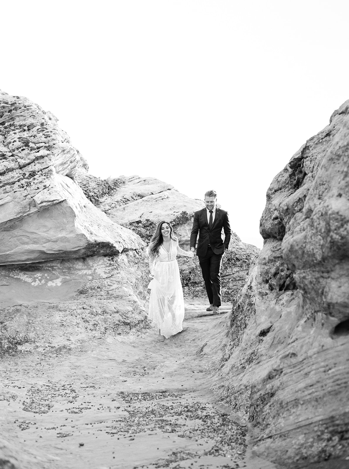 black and white pictures of a bride and groom exploring zion national park. moments after their elopement ceremony