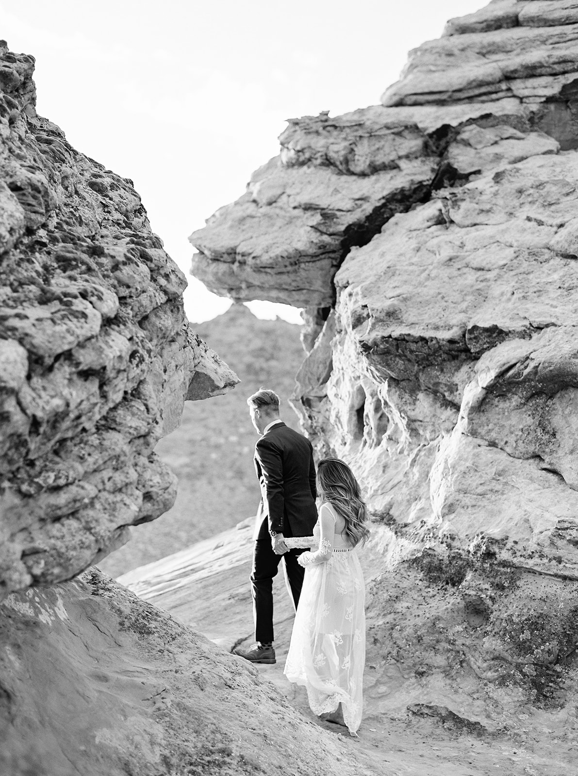 black and white pictures of a bride and groom exploring zion national park. moments after their elopement ceremony