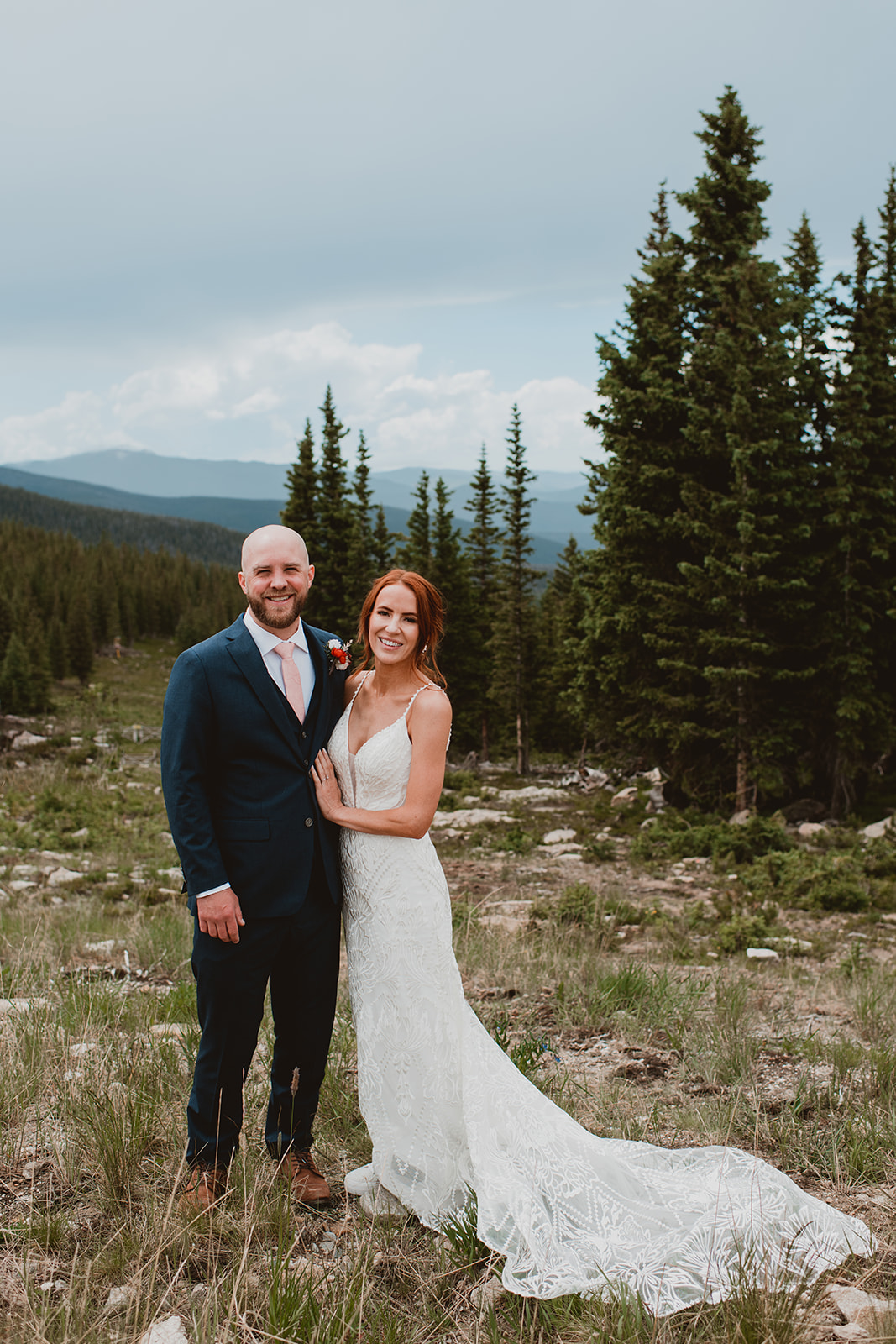 Bride and Groom walk at sunset in the mountains in Winter Park Colorado 