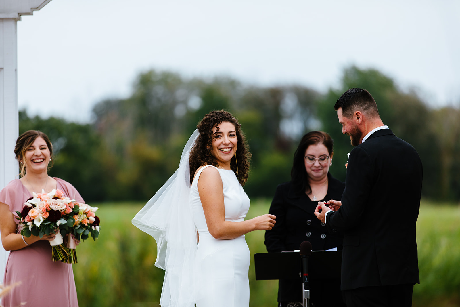 Bride and groom smile during their Syracuse, NY September wedding.