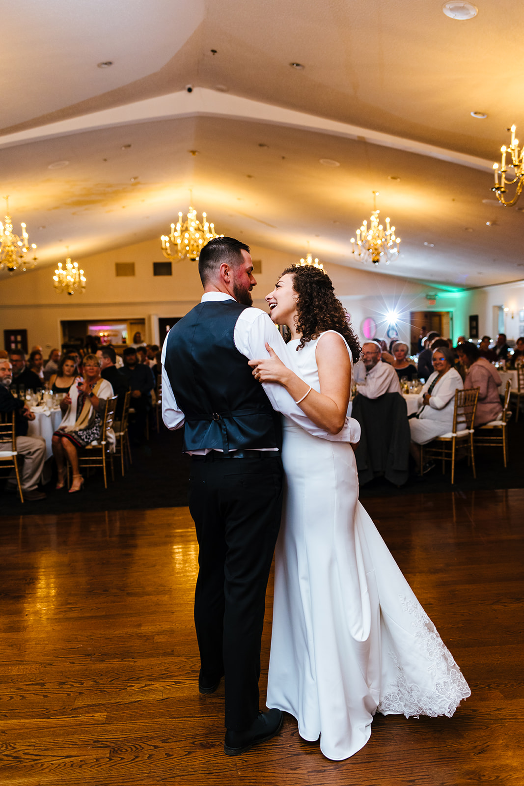 Bride and groom happily share a first dance at Traditions in Syracuse, NY.