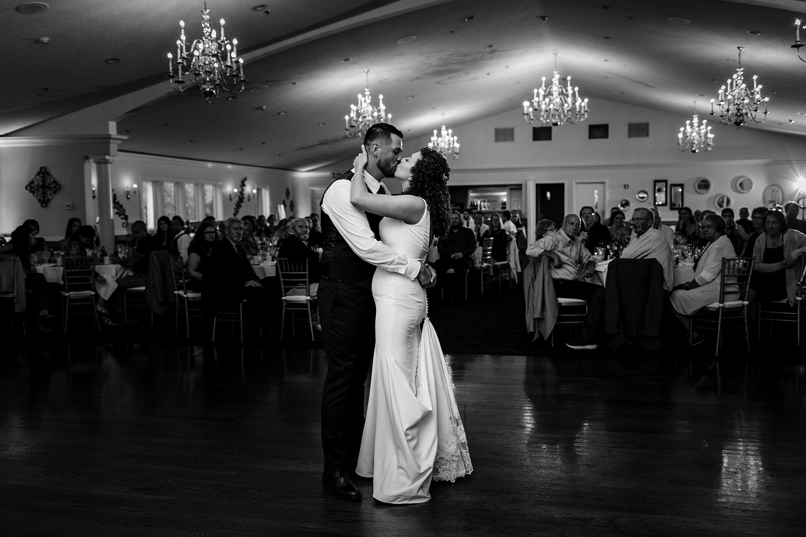 Bride and groom happily share a first dance at Traditions in Syracuse, NY.