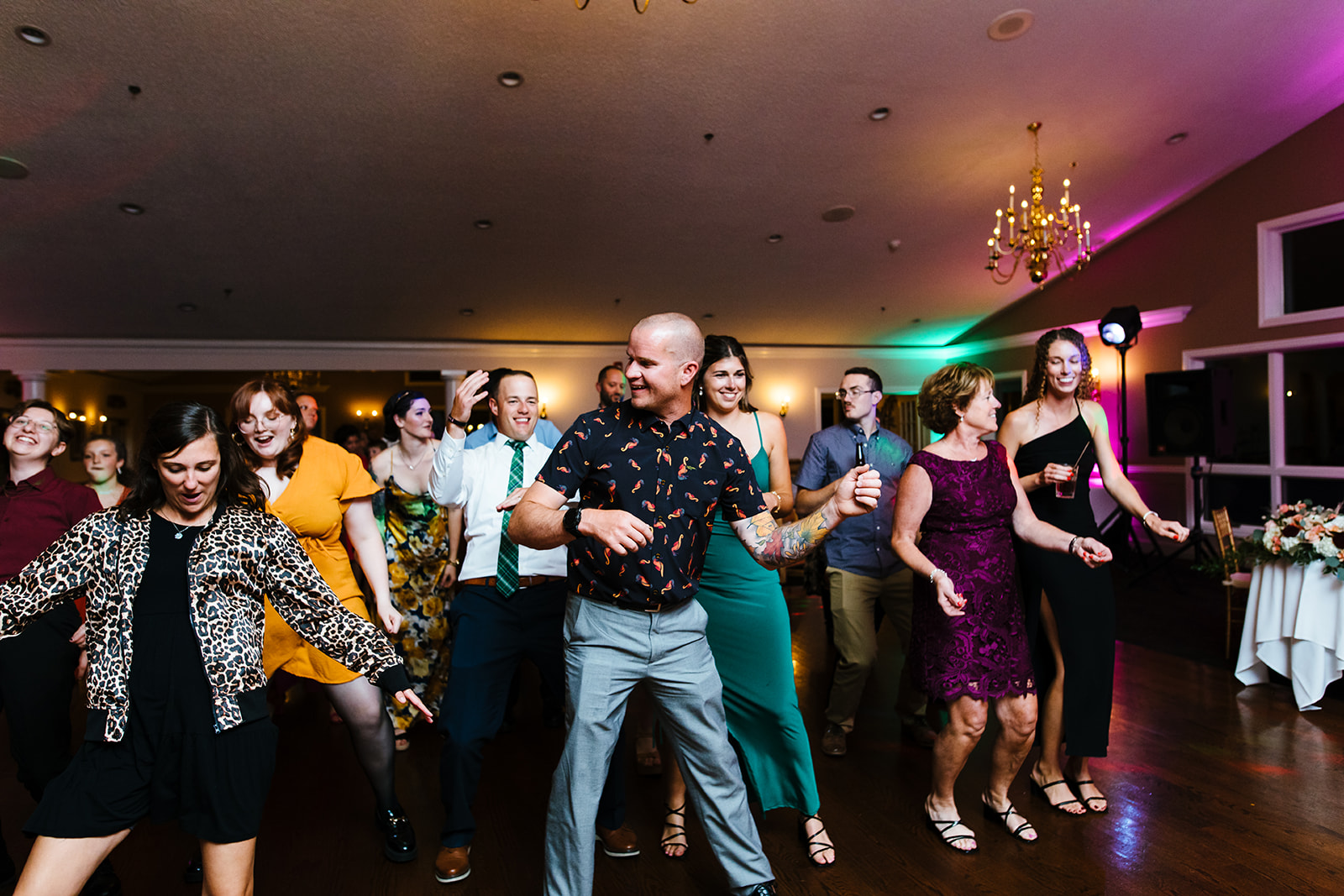 Guests party on the dancefloor at a wedding at Traditions in Syracuse, NY.