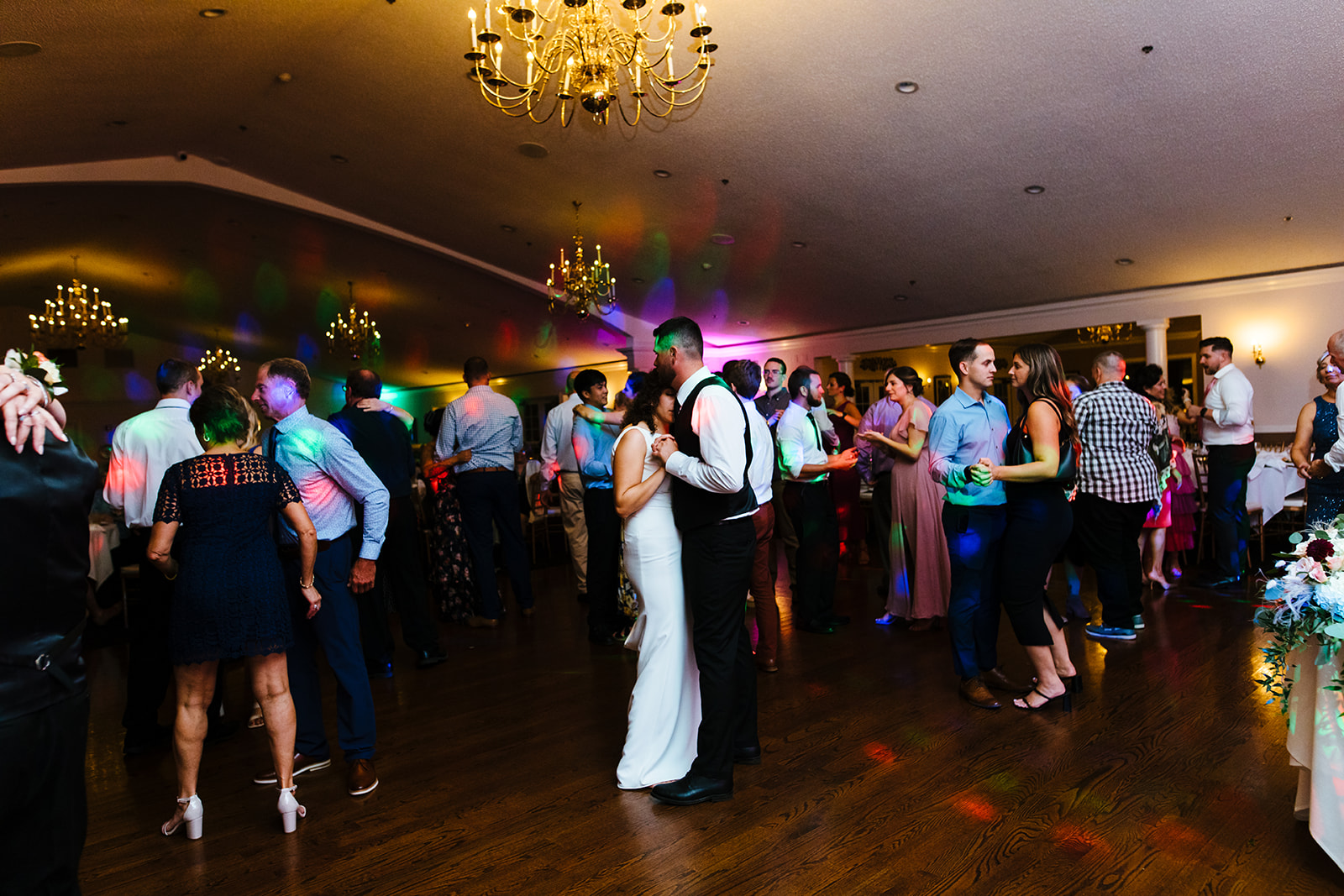 Guests party on the dancefloor at a wedding at Traditions in Syracuse, NY.