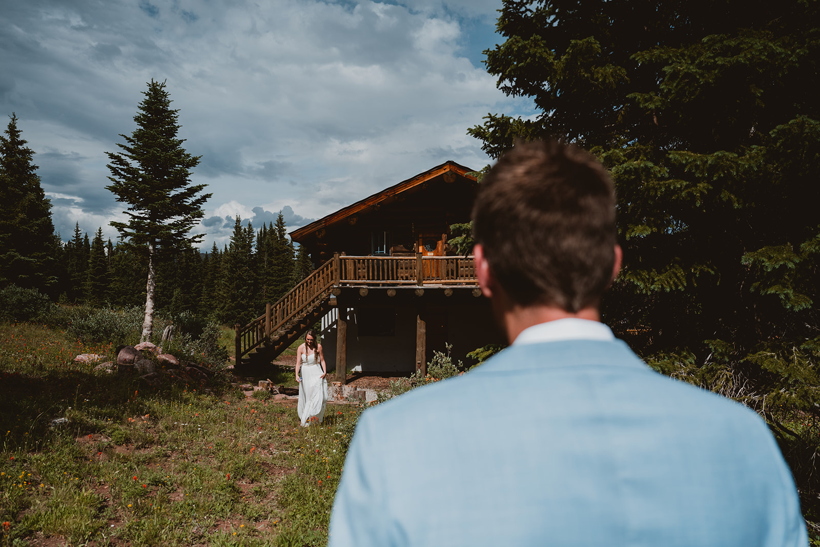 Shrine Pass Huts Summer Wedding, Frisco, CO. Groom waits for bride during first look in the mountains