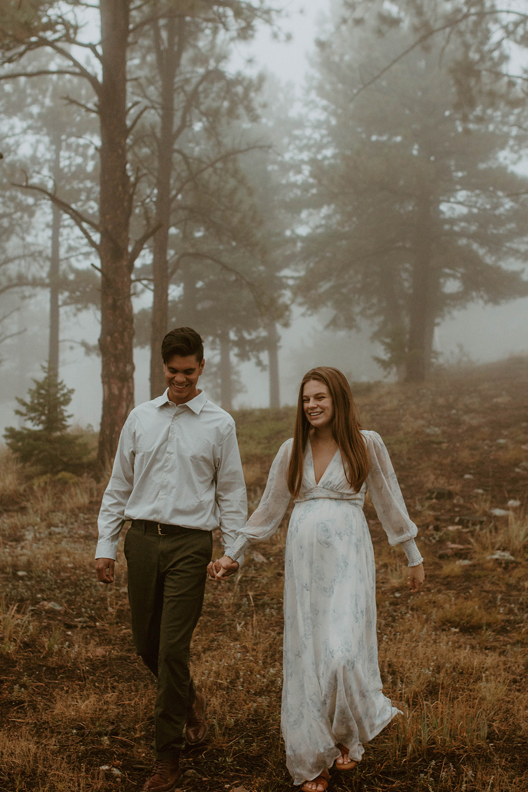 Couple in a foggy forest