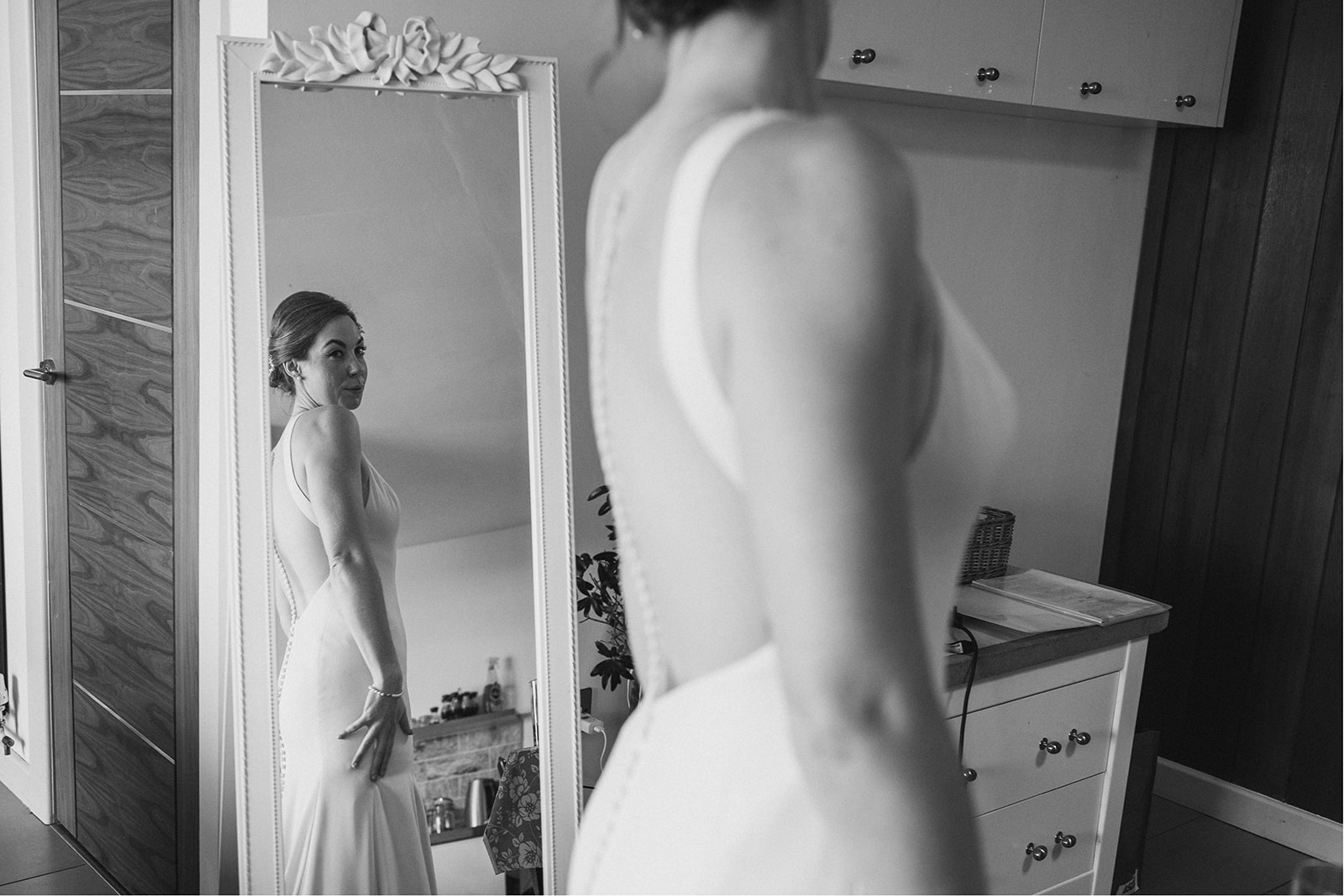 Derby DIY Farm Wedding Photography - the bride looking at herself in the mirror

