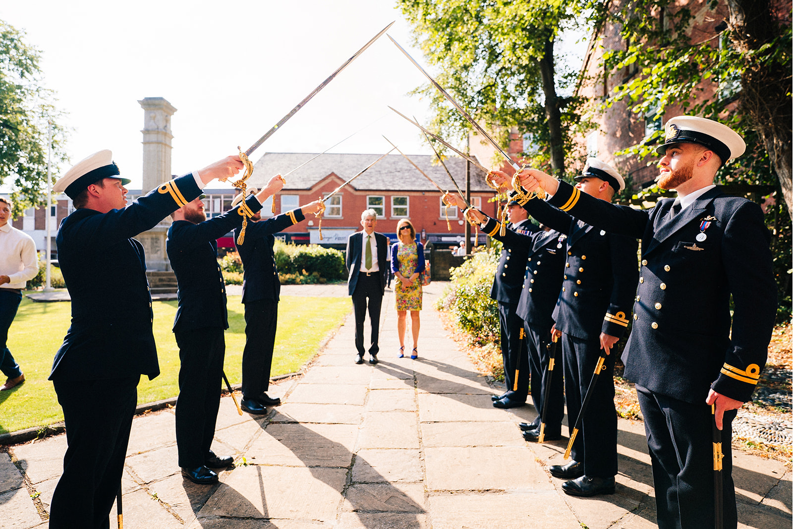 Derby DIY Farm Wedding Photography - the naval officers practice the sword salute
