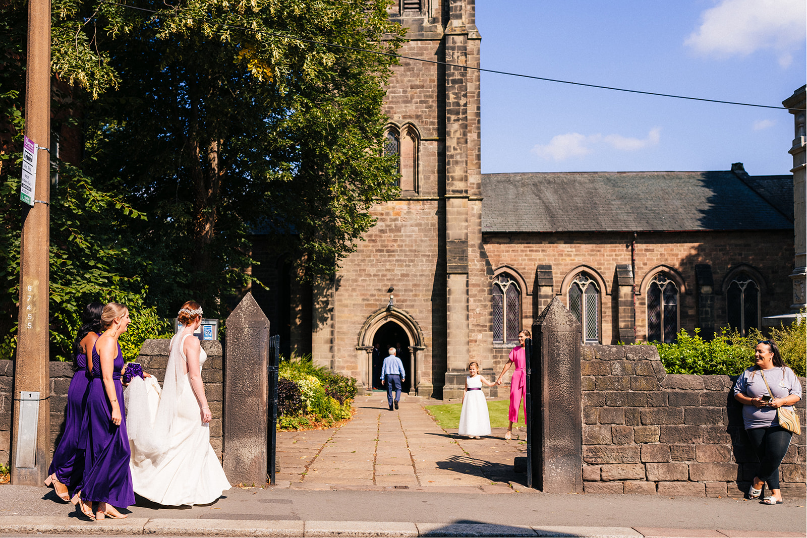 Derby DIY Farm Wedding Photography - the bride walking towards the church

