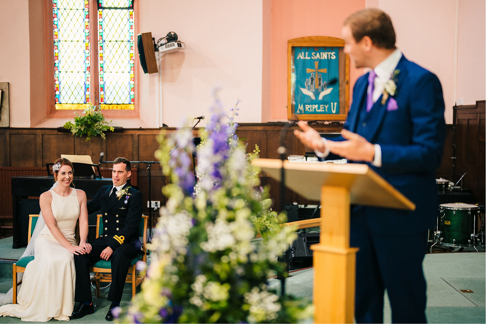 Derby DIY Farm Wedding Photography - the groom react to a wedding reading
