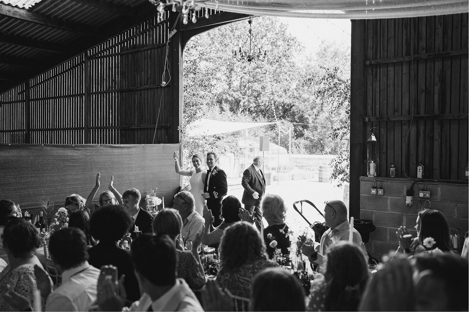 Derby DIY Farm Wedding Photography - bride and groom or an ounce into the barn the location for the wedding reception
