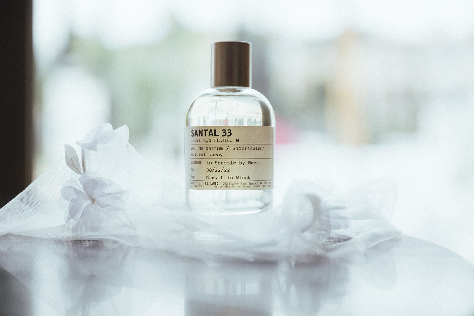 Brides wedding details included a personalized bottle of perfume from Santal 33. 