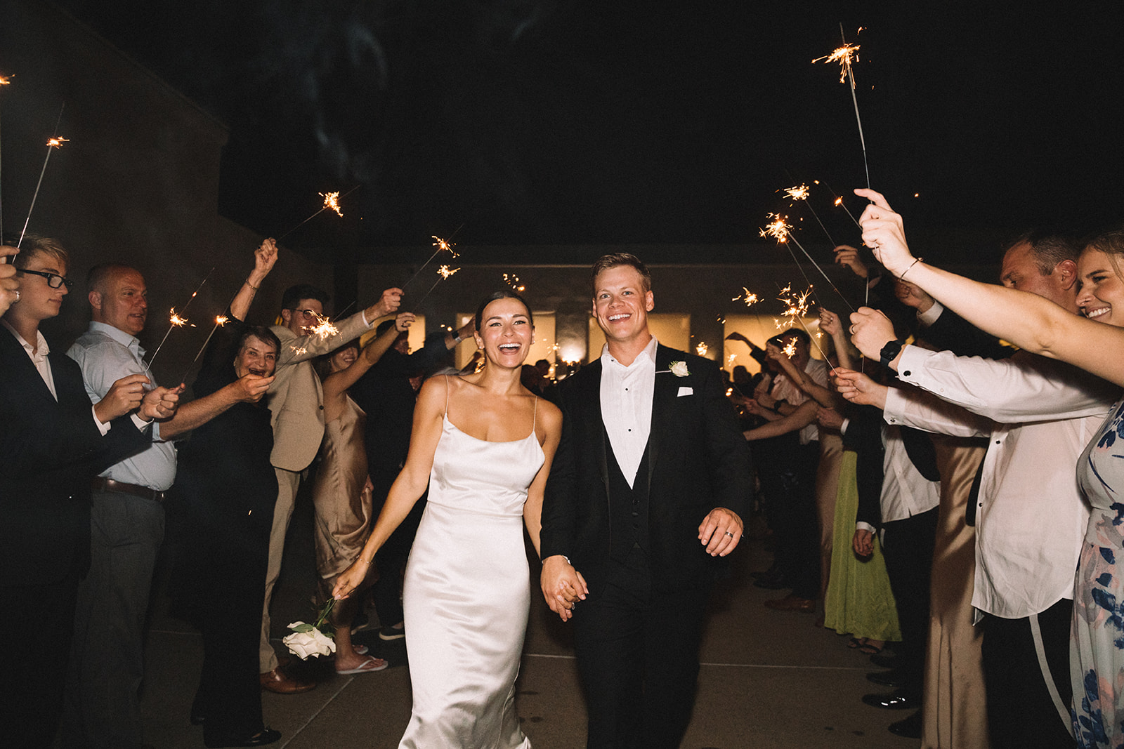 Couple exits their Marbella Country Club wedding with a sparkler exit in San Juan Capistrano. 