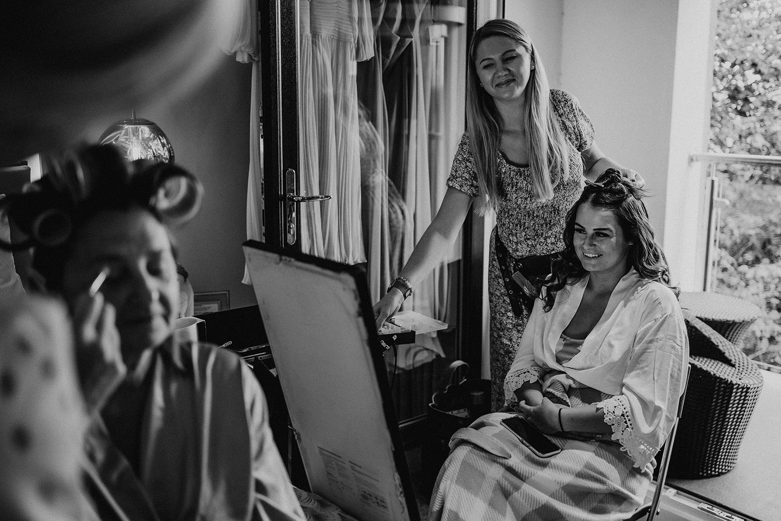 black and white image of morning prep in the bridal suite at a Sandy Cove Hotel wedding