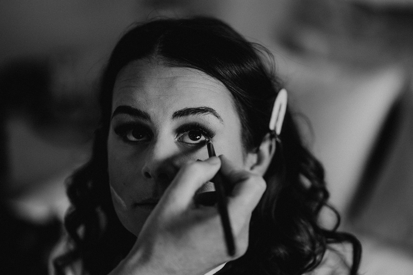 Black and white photo of bridal makeup at a Sandy Cove Hotel wedding