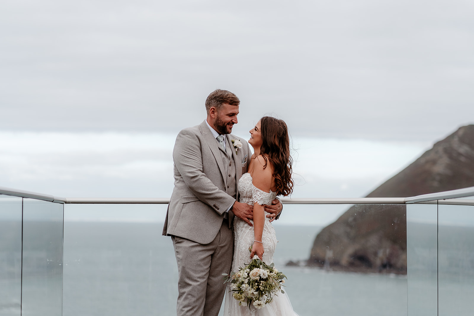 Bride and groom on the platform at their Sandy Cove Hotel wedding