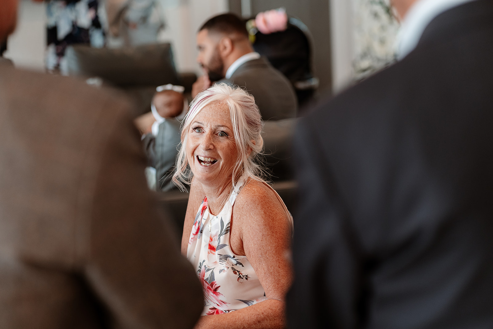 Mother of the groom laughs at a Sandy Cove Hotel wedding