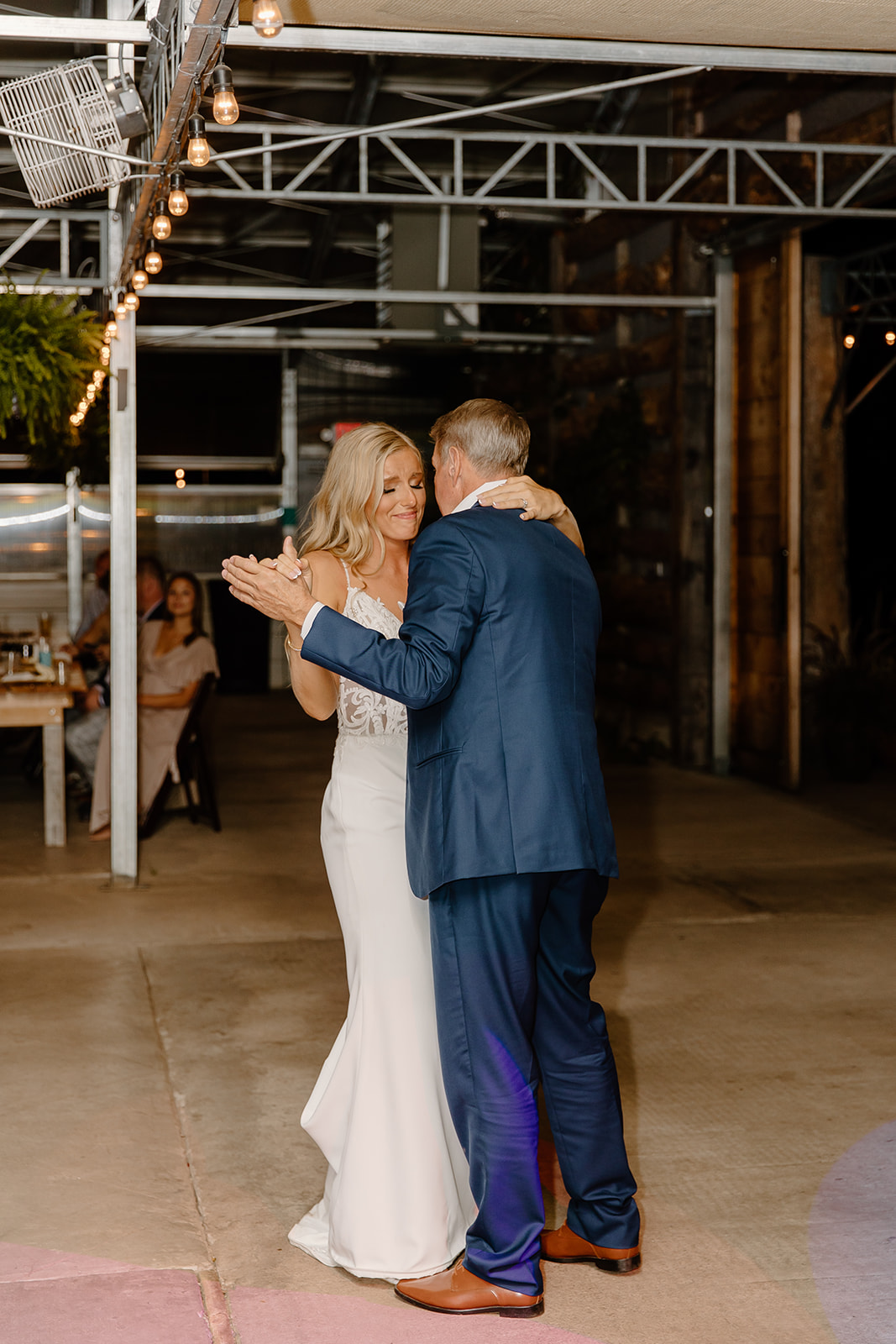 Bride and father dance during wedding reception