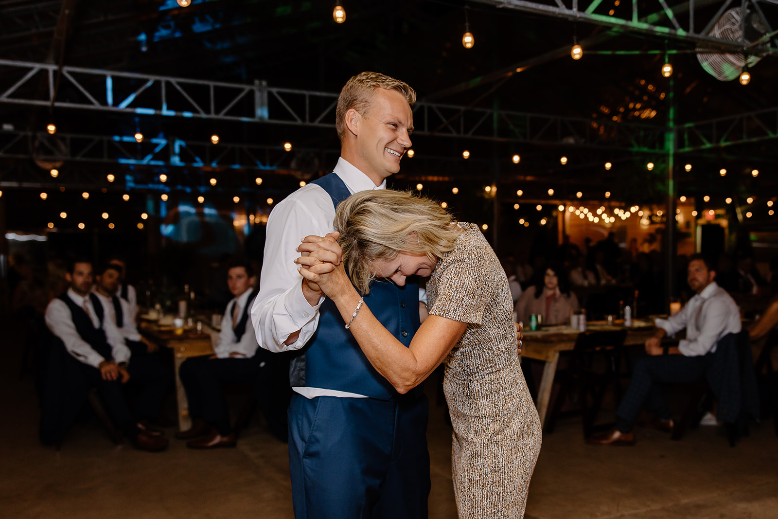 Groom and mother dance during wedding reception