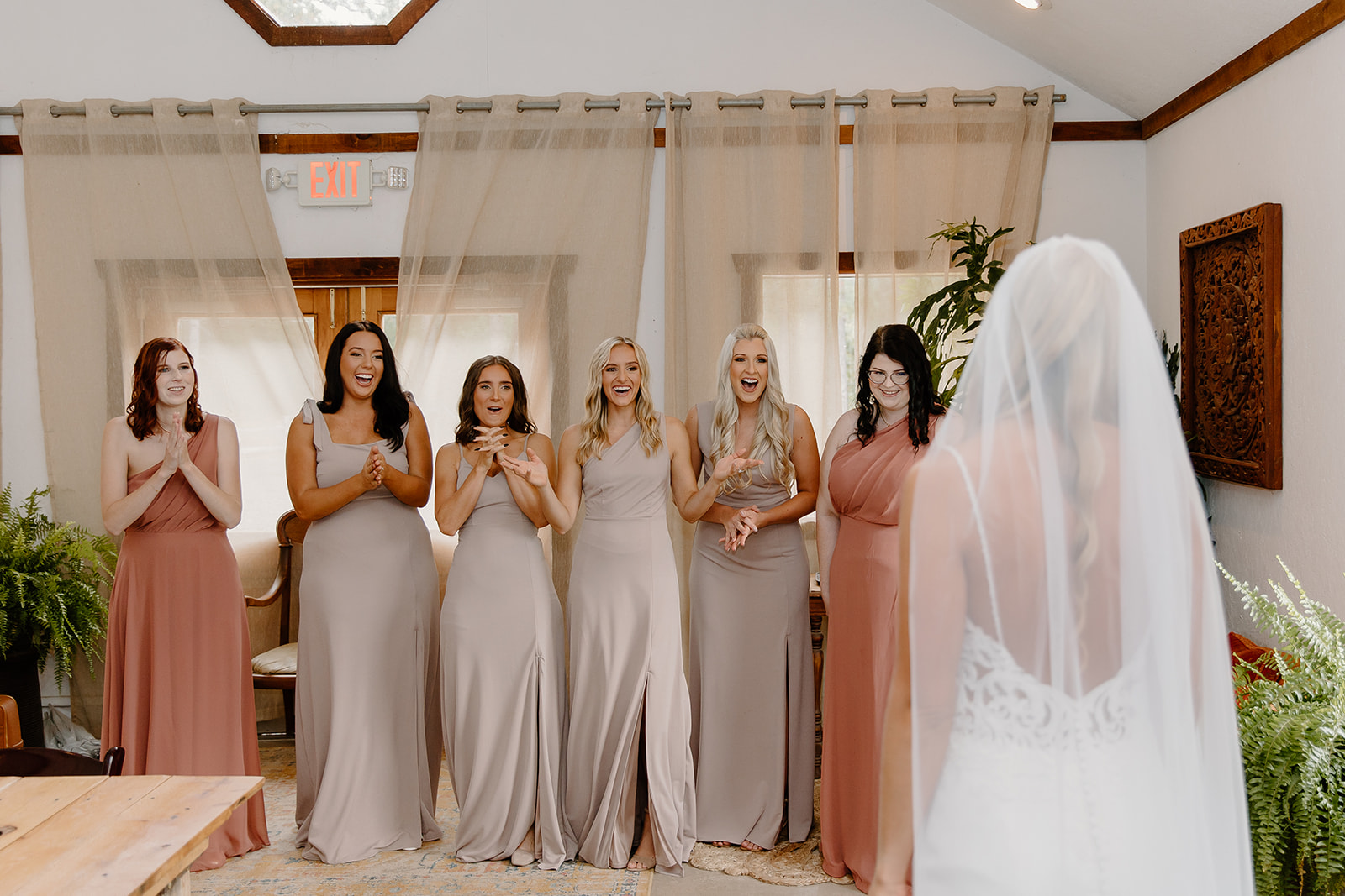 Bridesmaids react to seeing their friend as a bride