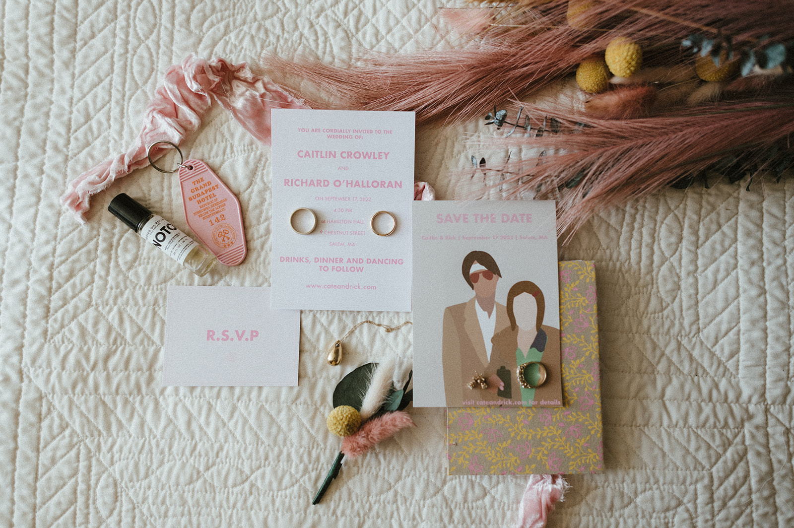 Flat lay of invitation and rings for Wes Anderson inspired wedding