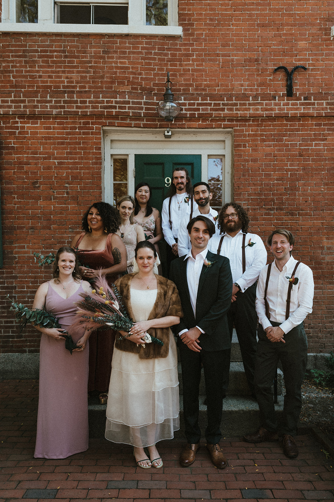 Wedding party pose with bride and groom for portraits at their Wes Anderson inspired wedding at Hamilton Hall in Salem