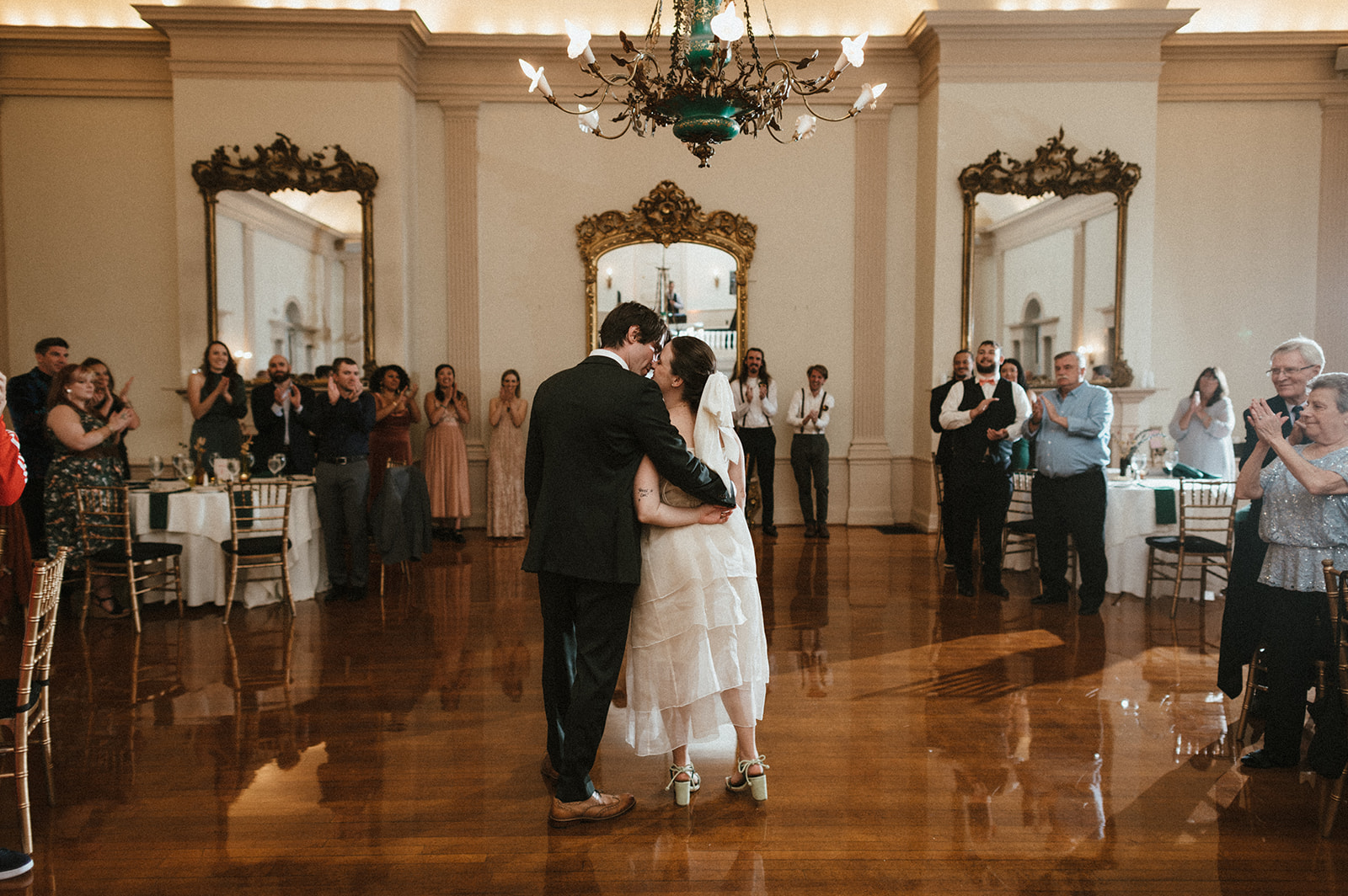Bride and groom share first dance during wedding at Salem's Hamilton Hall