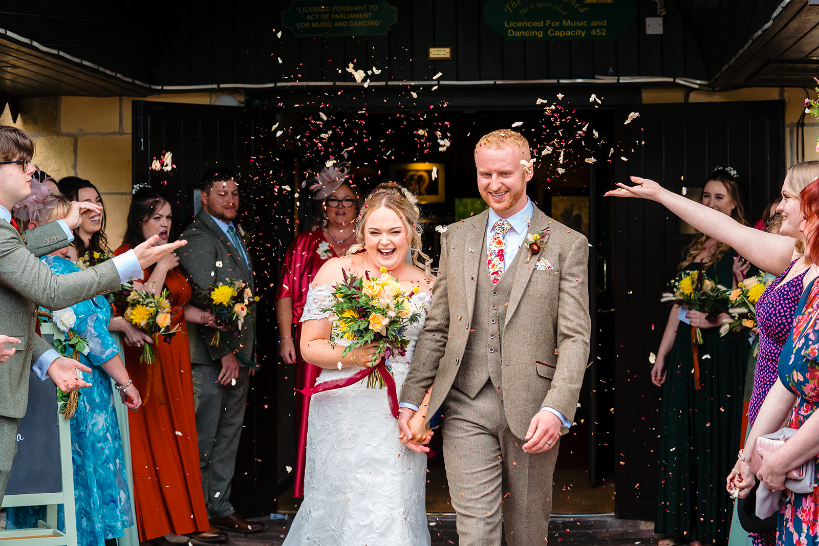 husband and wife confetti exit at the engine shed