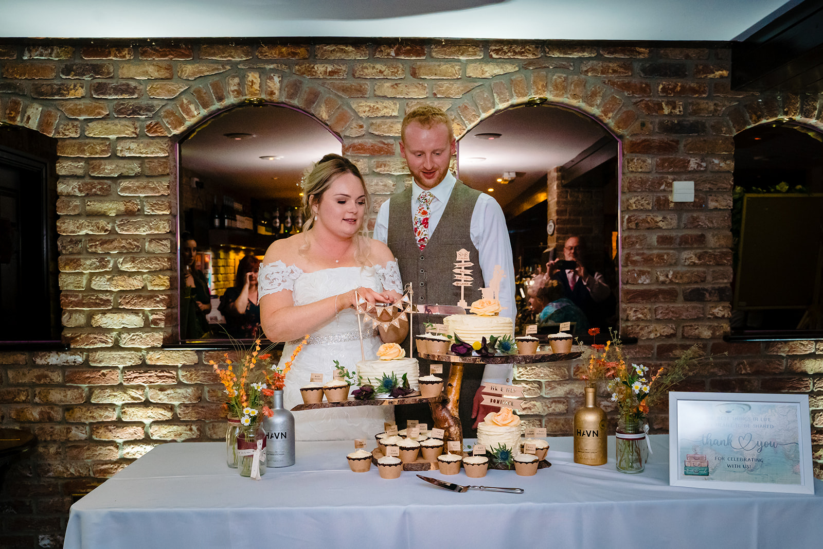 husband and wife cake cutting in the engine shed
