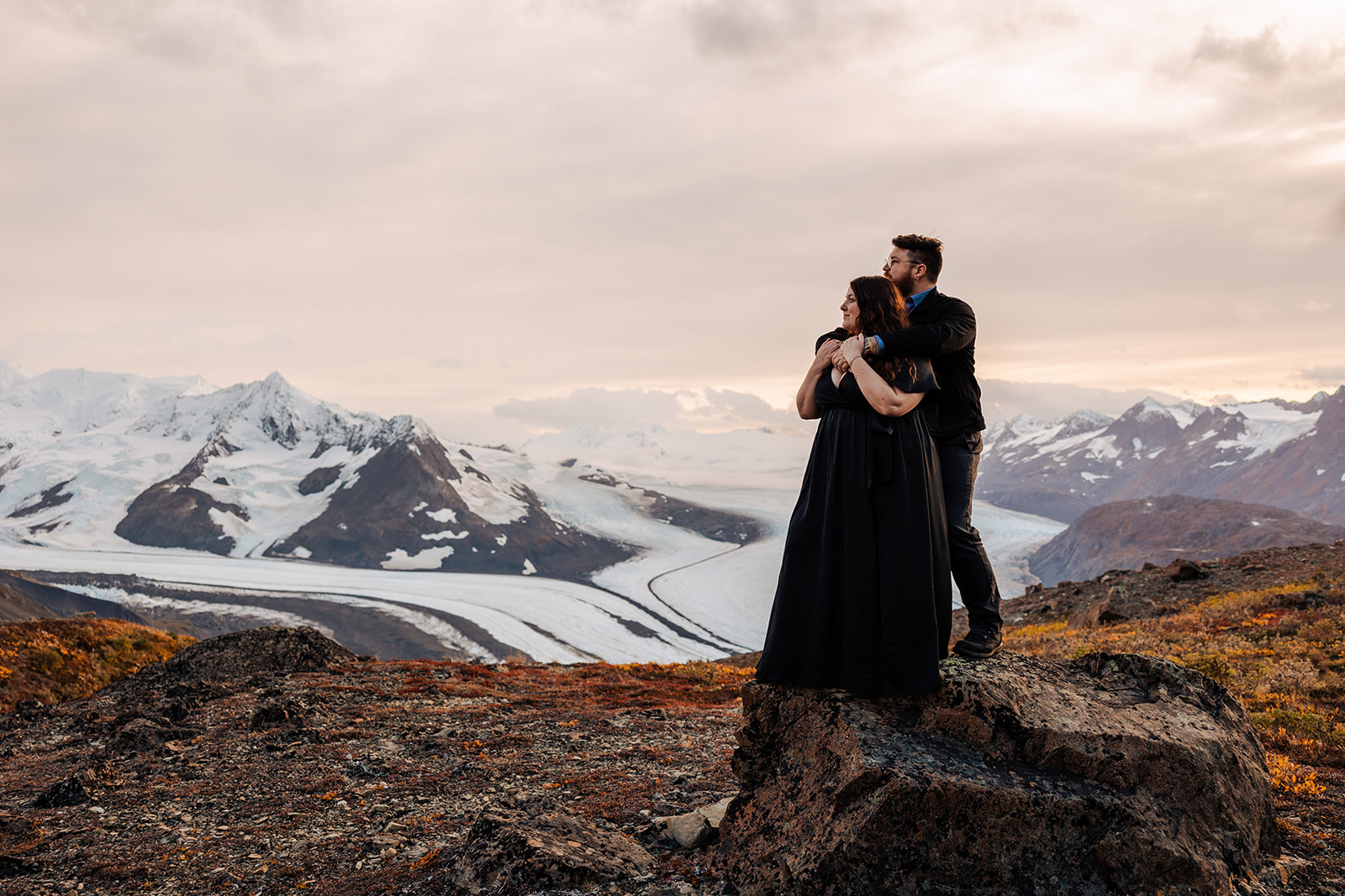 adventure engagement photos on top of a mountain in alaska