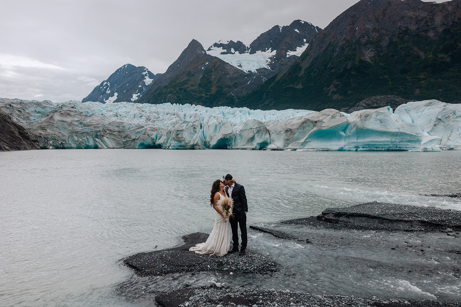 wedding couple flies in a helicopter for adventurous portraits in alaska