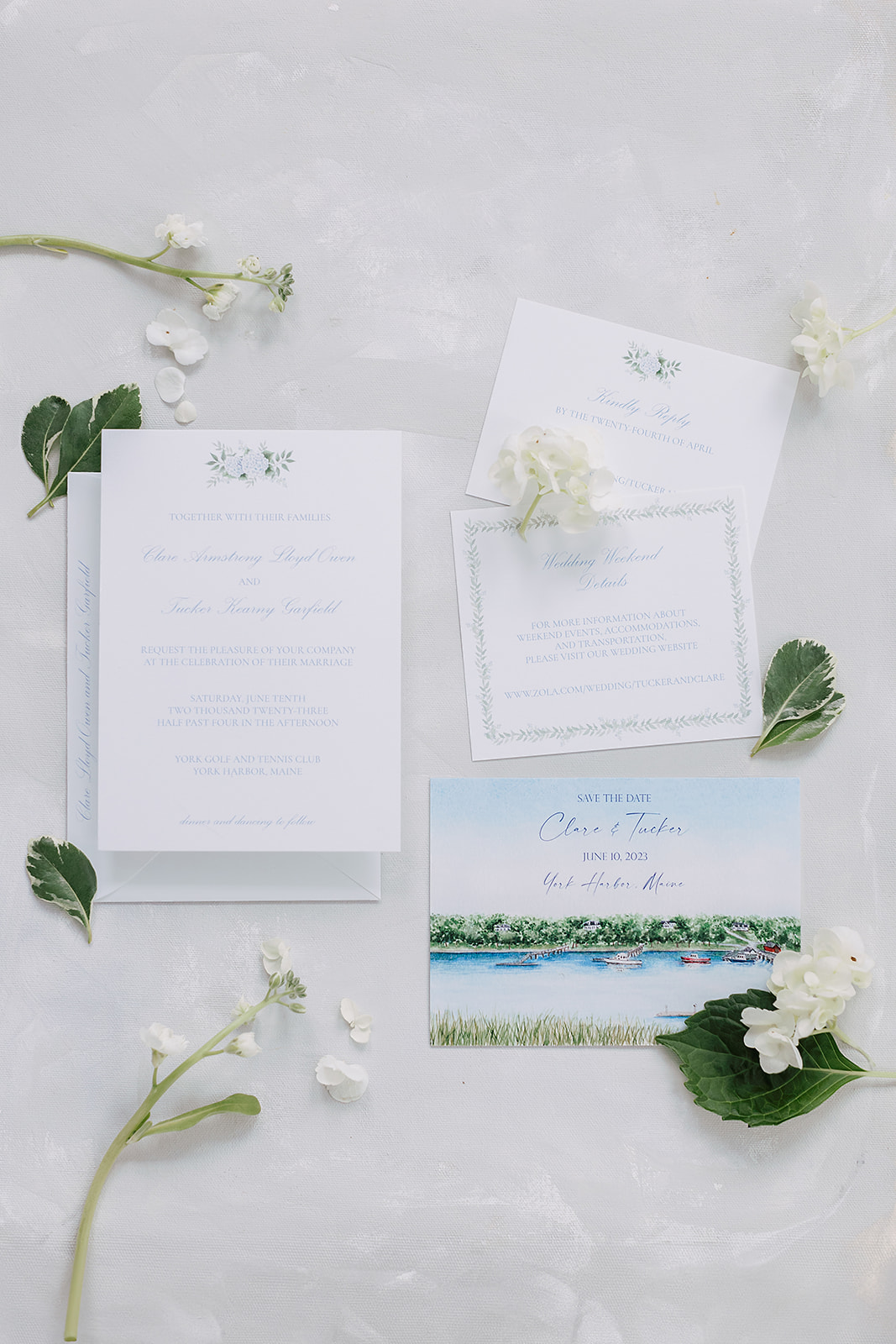 Layflat Wedding invitation suite by Emma Garfield  featuring elegant calligraphy and coastal details.