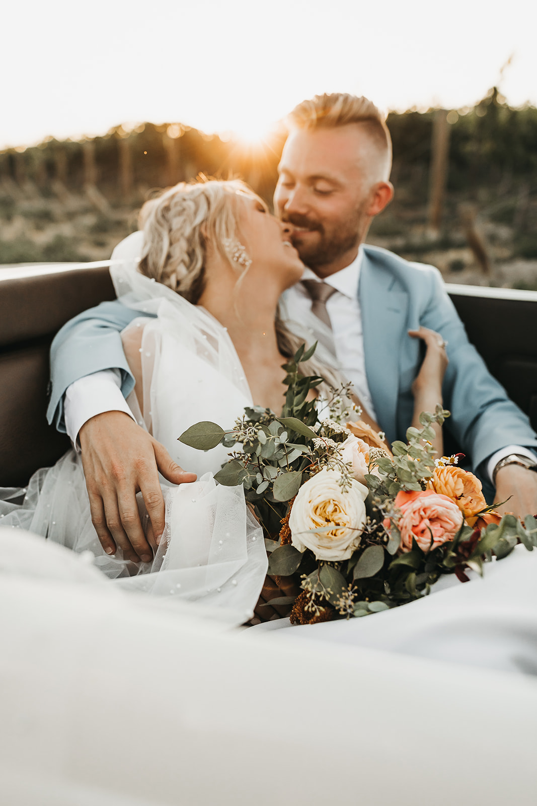 Golden hour photos of bride and groom sharing a special kiss
