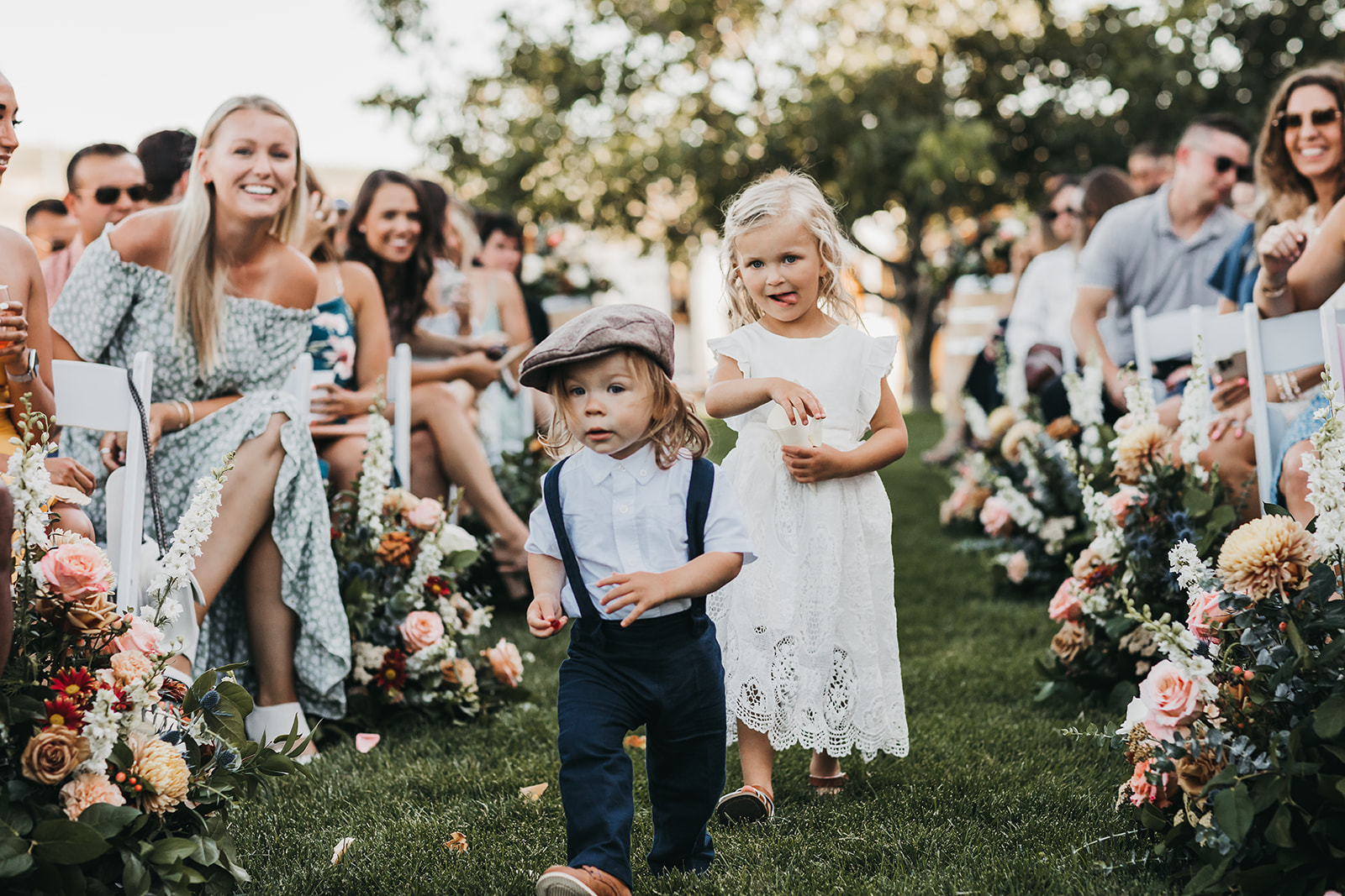 Ring barrier and flower girl walk down the aisle together