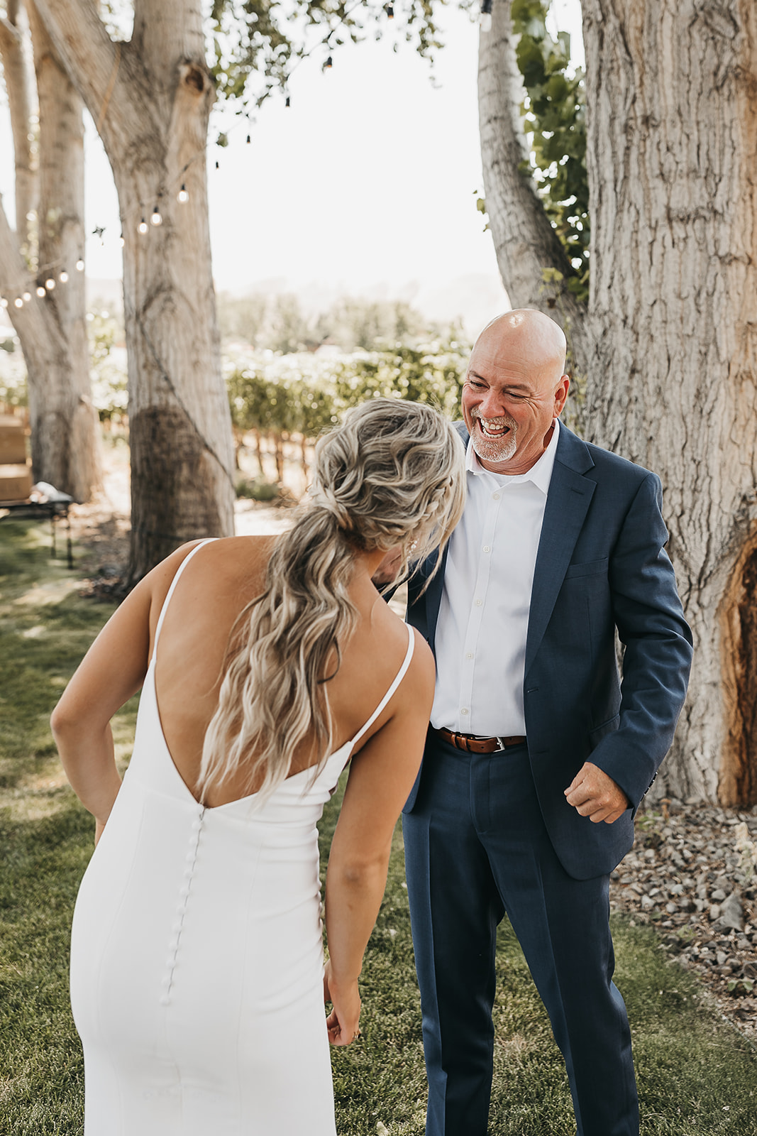 Bride and father of the bride sharing a laugh with each other before the wedding at Cooper Wine Company in Washington