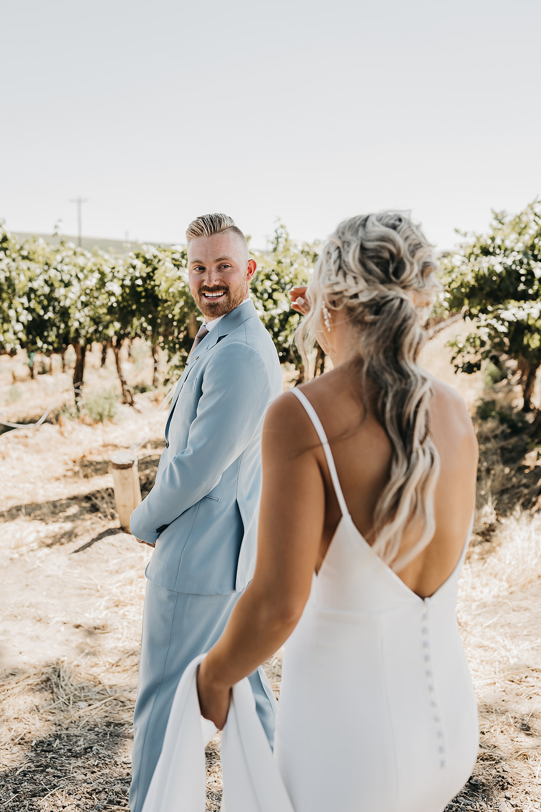 Bride and groom at first look at Cooper Wine Company in Washington