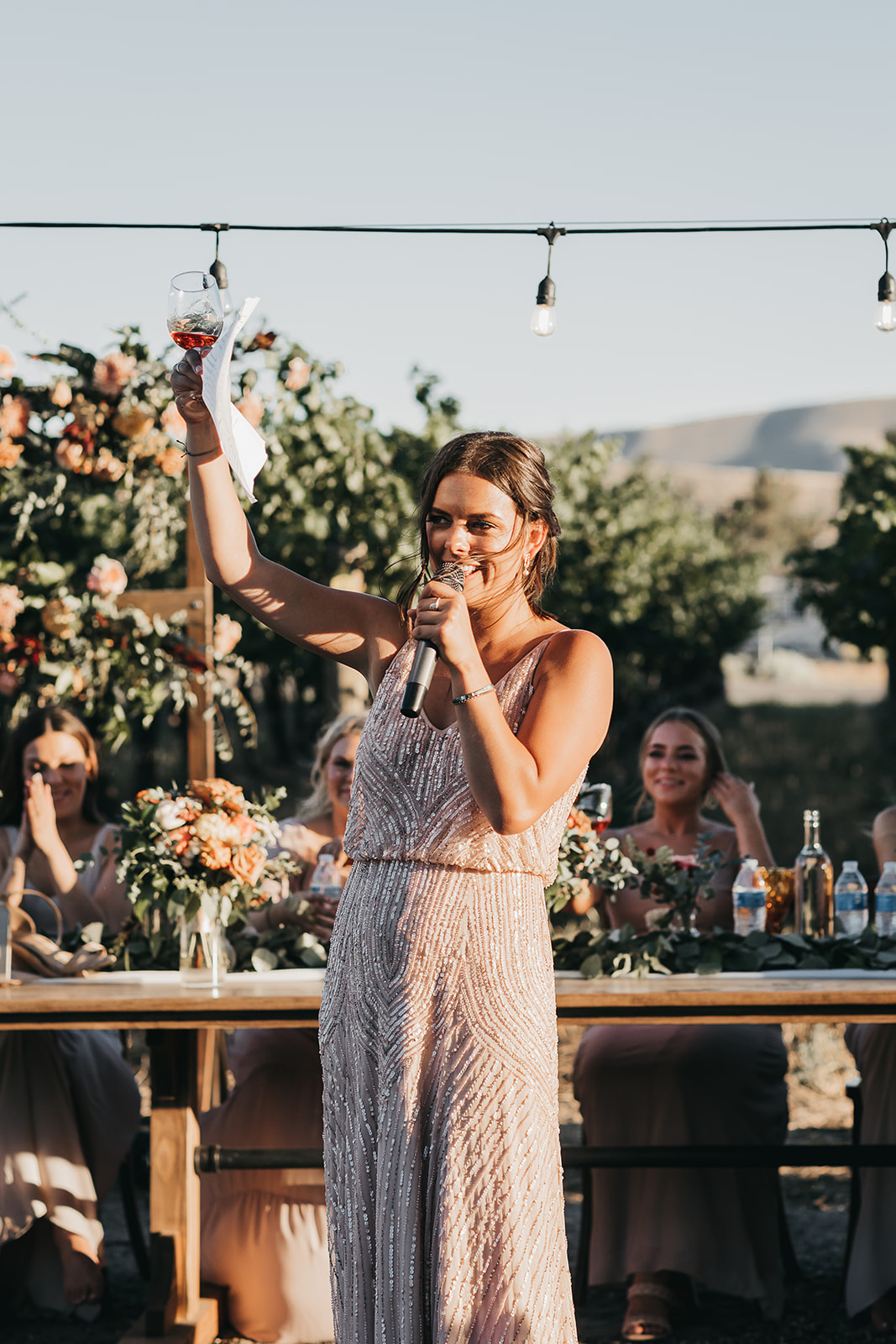 Maid of honor giving toast at reception at Copper Wine Company winery wedding