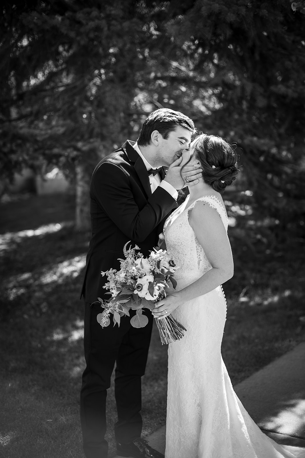 Bride and groom share a sweet kiss.